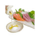 Ristet japansk sesamolie i en lille skål serveret med frisk sashimi – den smukke gyldne farve og den silkebløde konsistens fremhæver oliens fyldige nøddeagtige aroma og gør den perfekt som dip og finishing til sashimi og sushi.